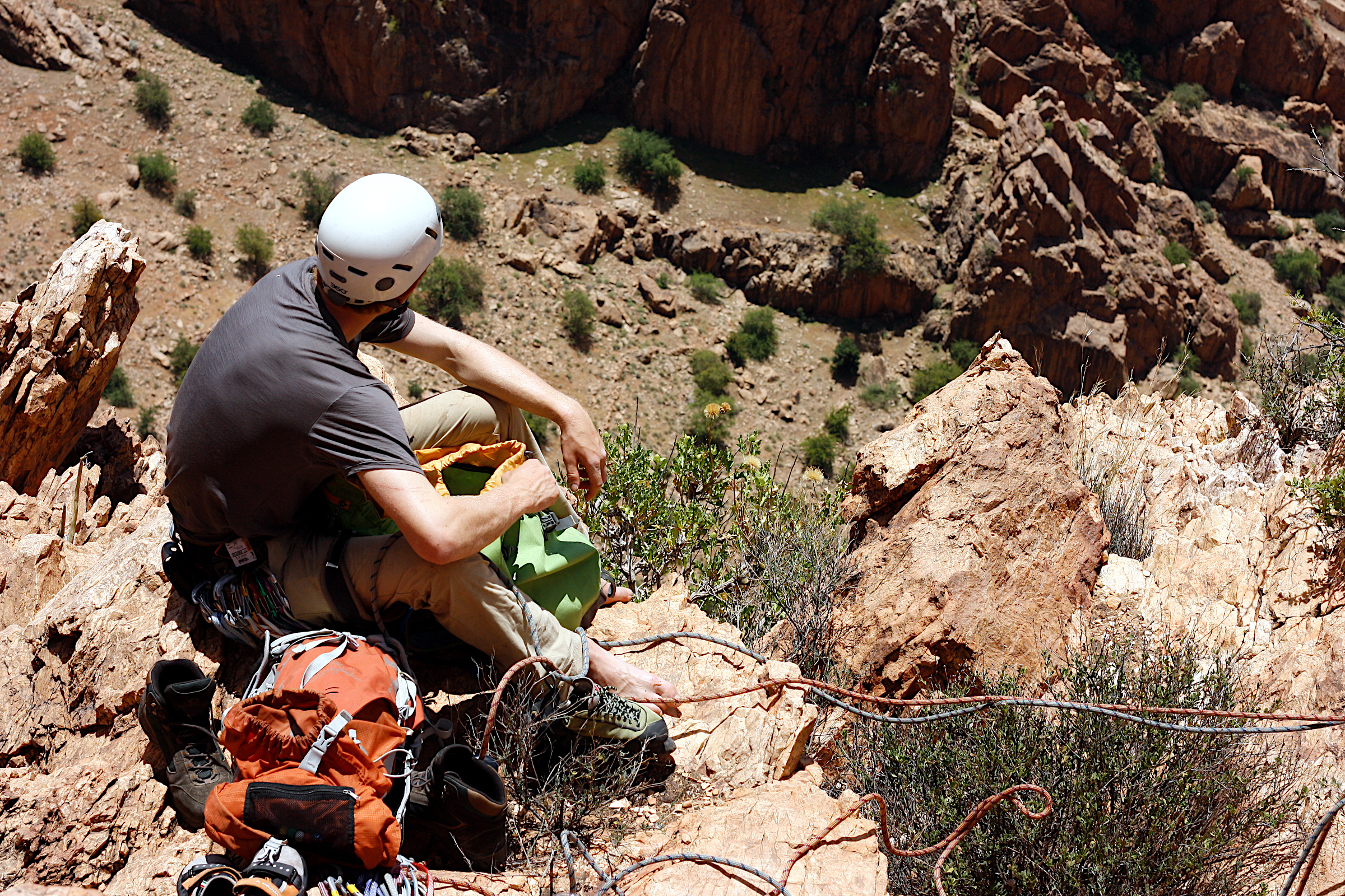 Mungo relaxing at the top of a first Ascent on Crag H, Anti Atlas, Morocco.